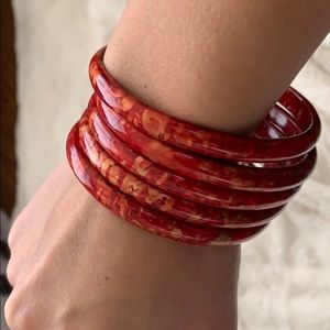Set of red wooden bangles